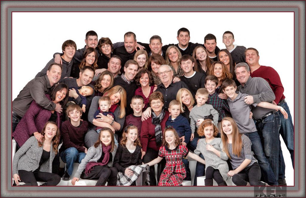 Fourty (40) people comfortably posed for a family grouping in the studio. Specialists in large family groups.