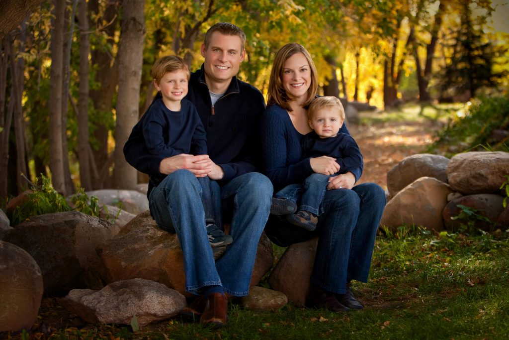 Young family of 4 outdoors