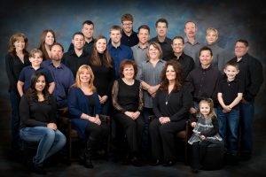 A family of 23 in black, blue and grey.