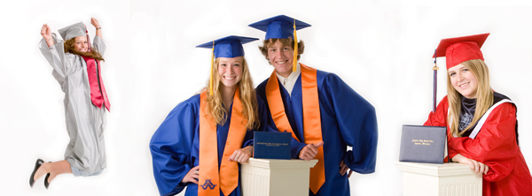Two teenagers are posing their graduation garb including caps and gowns