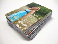 A stack of wallet size portraits
